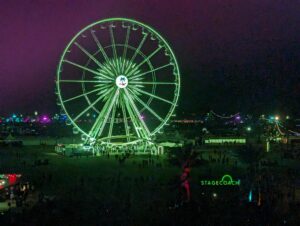 The ferris wheel lit up at night
